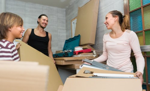 Estimator reviewing access details before a removals quote