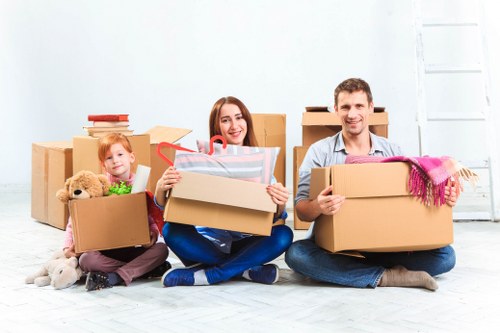 Local moving team handling household items safely during a removals van service