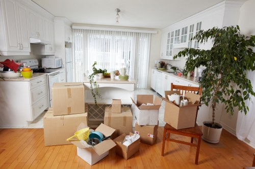 Office equipment and furniture being organised for relocation
