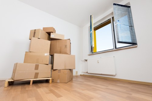 Local removals team handling furniture and boxes