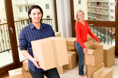 Removal team packing and loading household items in West London